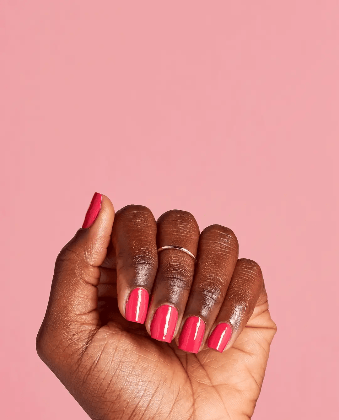 OPI Charged Up Cherry nail polish bottle with vibrant red color and glossy finish, showcasing the OPI brand and product label.