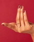 OPI Nail Polish in Como Se Llama? shade, showcasing vibrant, glossy nail color with the OPI branding visible.