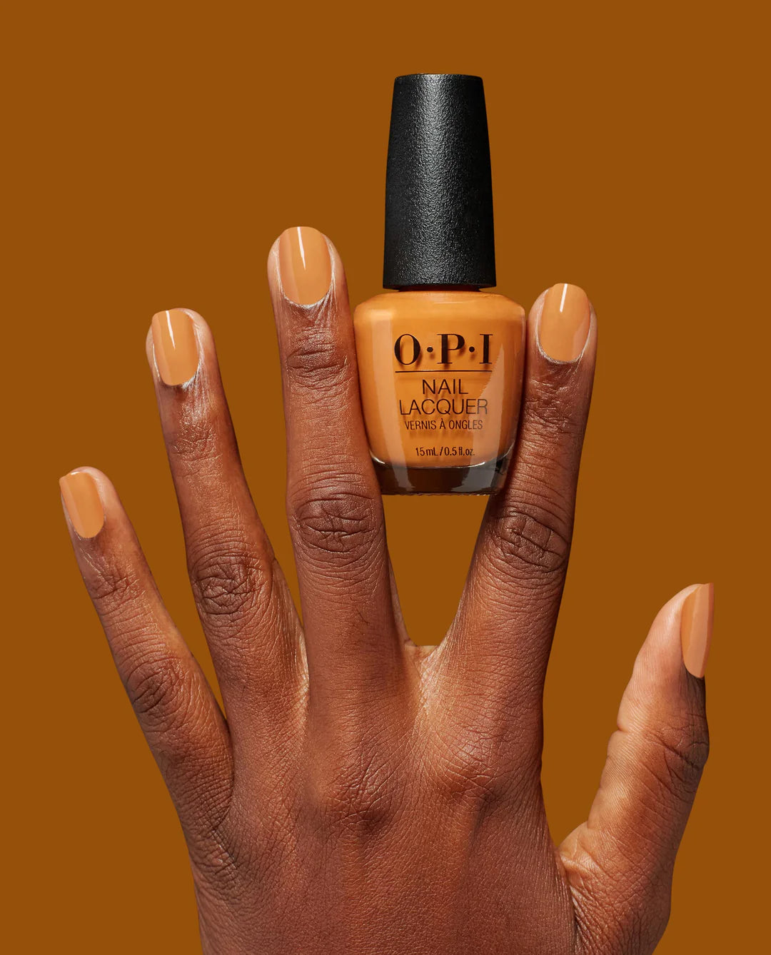 OPI Nail Polish Fall What's Your Mani-tude? 2025 in Penny Loafer Lane, showing the clear nail lacquer bottle and a hand with painted nails