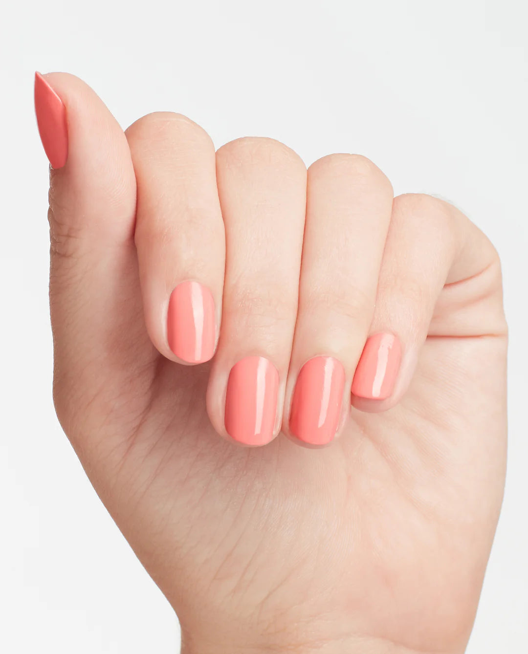 OPI Nail Polish in Got Myself Into A Jam-Balaya, vibrant orange-red shade, shown in a hand with manicured nails.