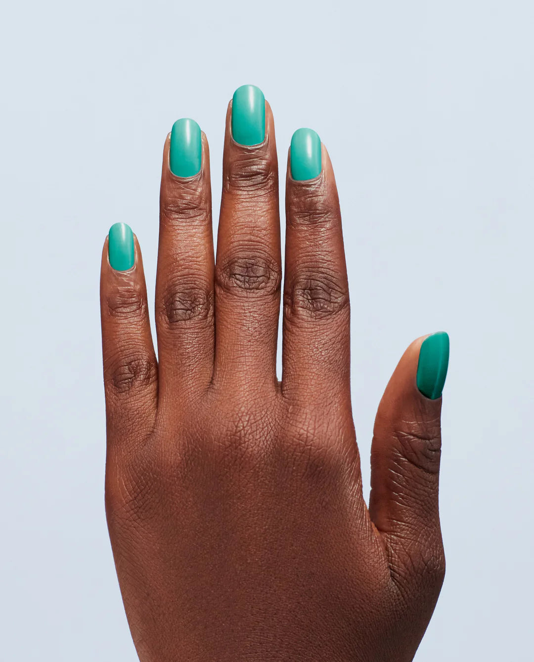 OPI Nail Polish in I’m Yacht Leaving, showcasing a glossy blue-green manicure with smooth, even application on nails.