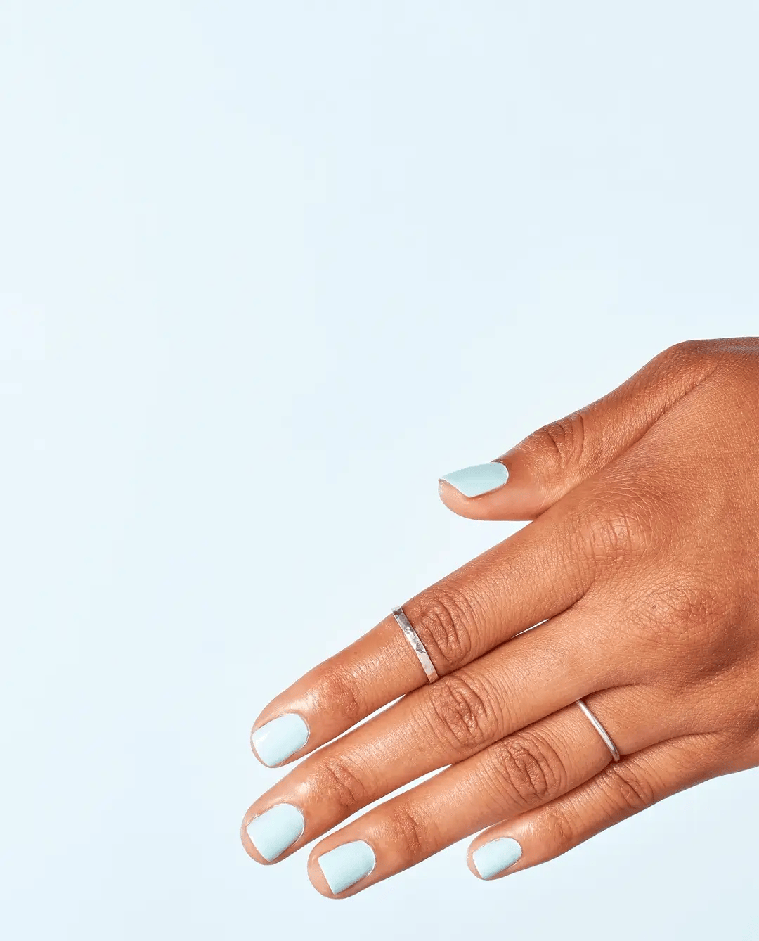 OPI Nail Polish in It's A Boy #T75 featuring a vibrant blue shade, displayed in a sleek bottle with a white cap.