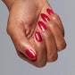 OPI Kiss My Aries #H025 nail polish bottle with pinkish-red color and branding visible on the label.