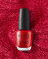 OPI Kiss My Aries nail polish bottle with vibrant red polish and brand label, showcasing the nail lacquer's packaging.