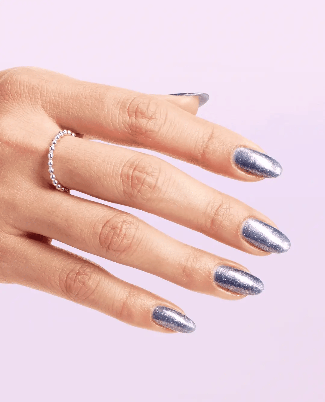 Hand with OPI Leonardo's Model Color MI011 nail polish, showcasing a vibrant nail color on neatly groomed nails.