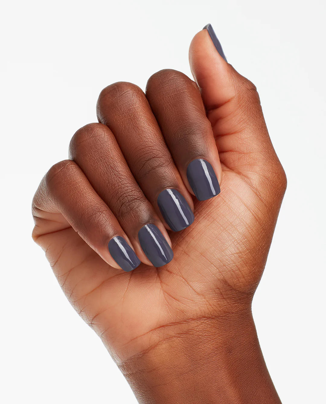 OPI Nail Polish Less is Norse #I59 showing a close-up of the bottle and swatch with dark, muted gray nail color.