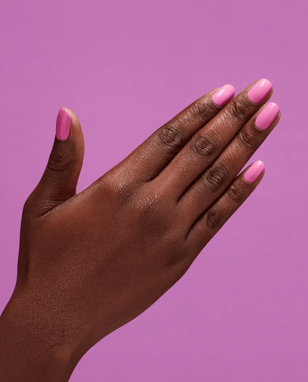 OPI Nail Polish in Makeout-Side #P002, vibrant pink shade, shown in a sleek nail polish bottle with brush applicator.