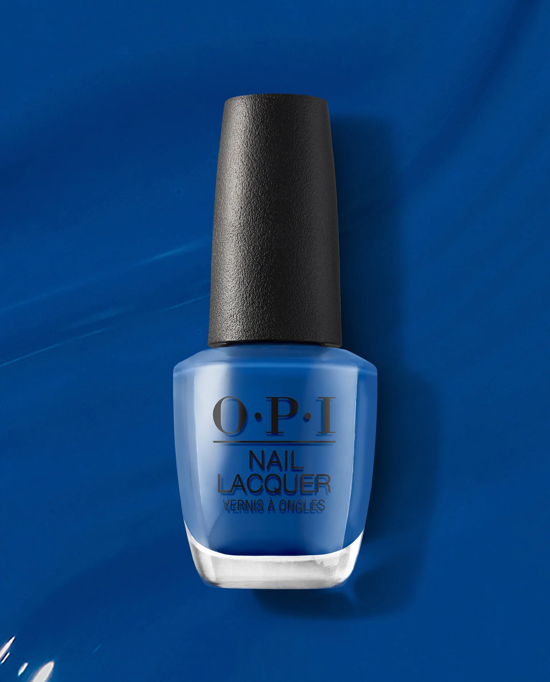 OPI Nail Polish in Mi Casa Es Blue Casa #M92, vibrant blue nail lacquer in a sleek bottle with a white cap.