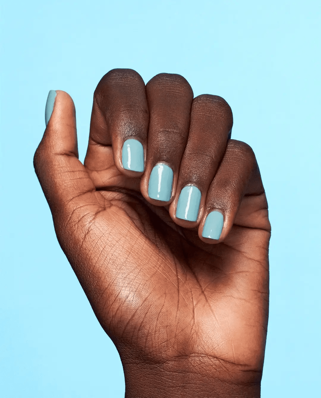 OPI Nail Polish in NFTease me NLS006 with glossy finish, showcasing the vibrant color and smooth application.