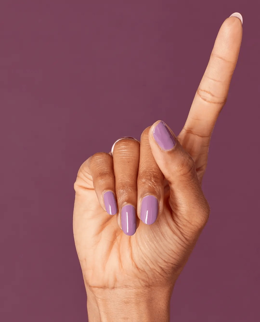 OPI Nail Polish in One Heckla of a Color! NLI62, bright pink shade, smooth glossy finish, bottle with OPI branding visible.