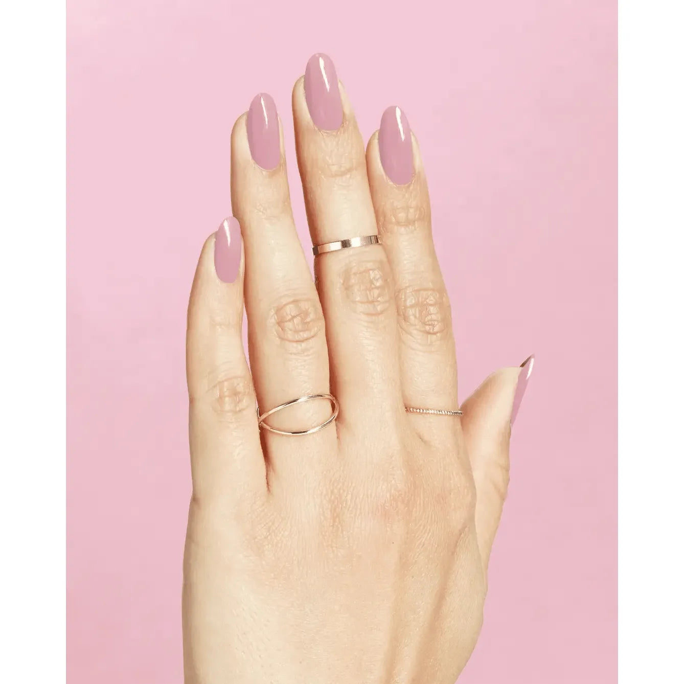 OPI Nail Polish in Ink on Canvas, pink shade, bottle with brush, showcasing smooth, glossy finish and vibrant color.