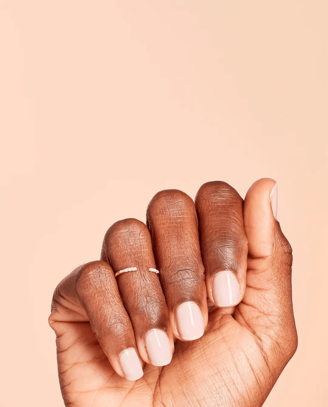 OPI Nail Polish in Put It In Neutral shade, a beige neutral nail polish bottle with color swatch on the cap.