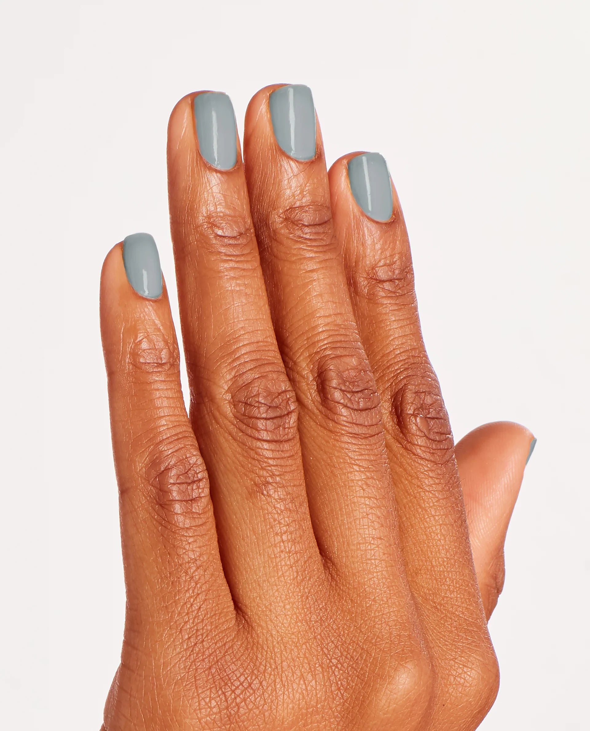 OPI Nail Polish in Ring Bare-Er, a beige neutral shade, displayed in the bottle with a smooth, glossy finish.