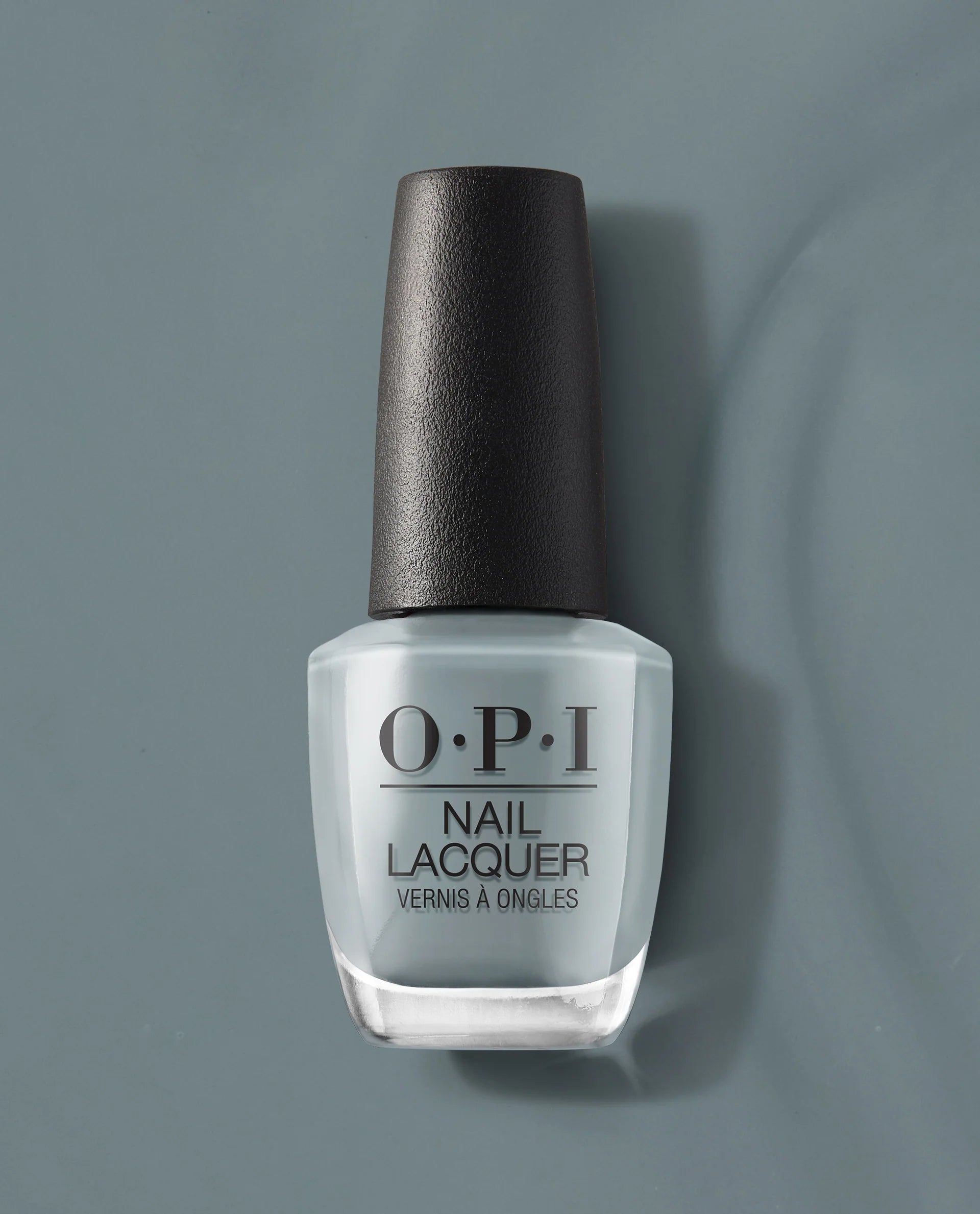 Close-up of OPI Nail Polish in Ring Bare-Er, showcasing the nude-colored nail lacquer in a sleek bottle.