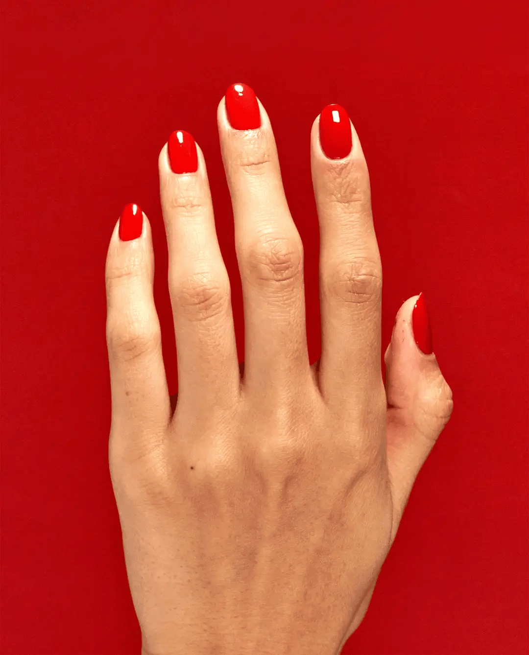 OPI Nail Polish in Rust & Relaxation shade, a warm rust-colored nail polish bottle with brush visible inside.