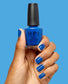 OPI Sea-ze The Day nail polish bottle and hand showing off the vibrant sea-green color, glossy finish, and sleek design.