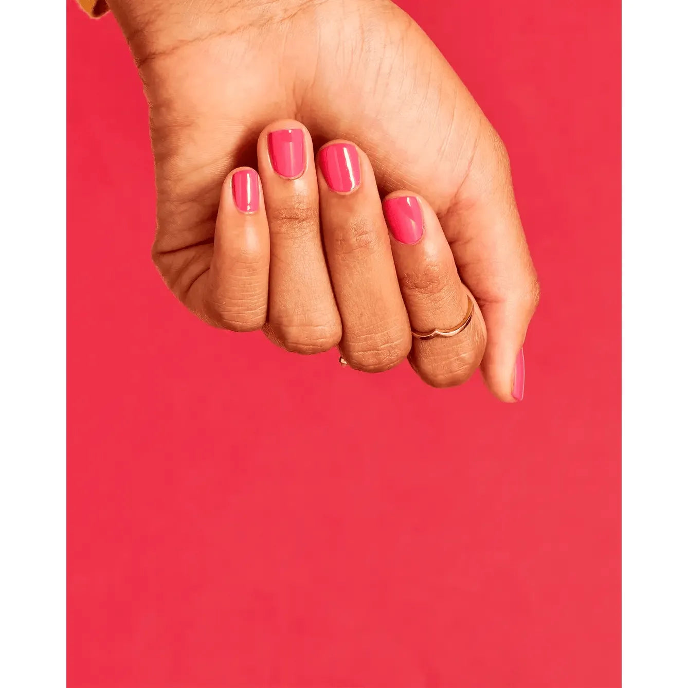 OPI Nail Polish in Strawberry Margarita shade, showcasing vibrant pink color and glossy finish in a close-up image.