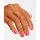 OPI Nail Polish in Strawberry Margarita shade, vibrant pink-red color for nails, shown on a hand with a manicured look.