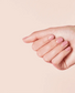 OPI Nail Polish in Suzi Calls the Paparazzi shade, showing a close-up of the vibrant, glossy nail polish bottle with the label visible.