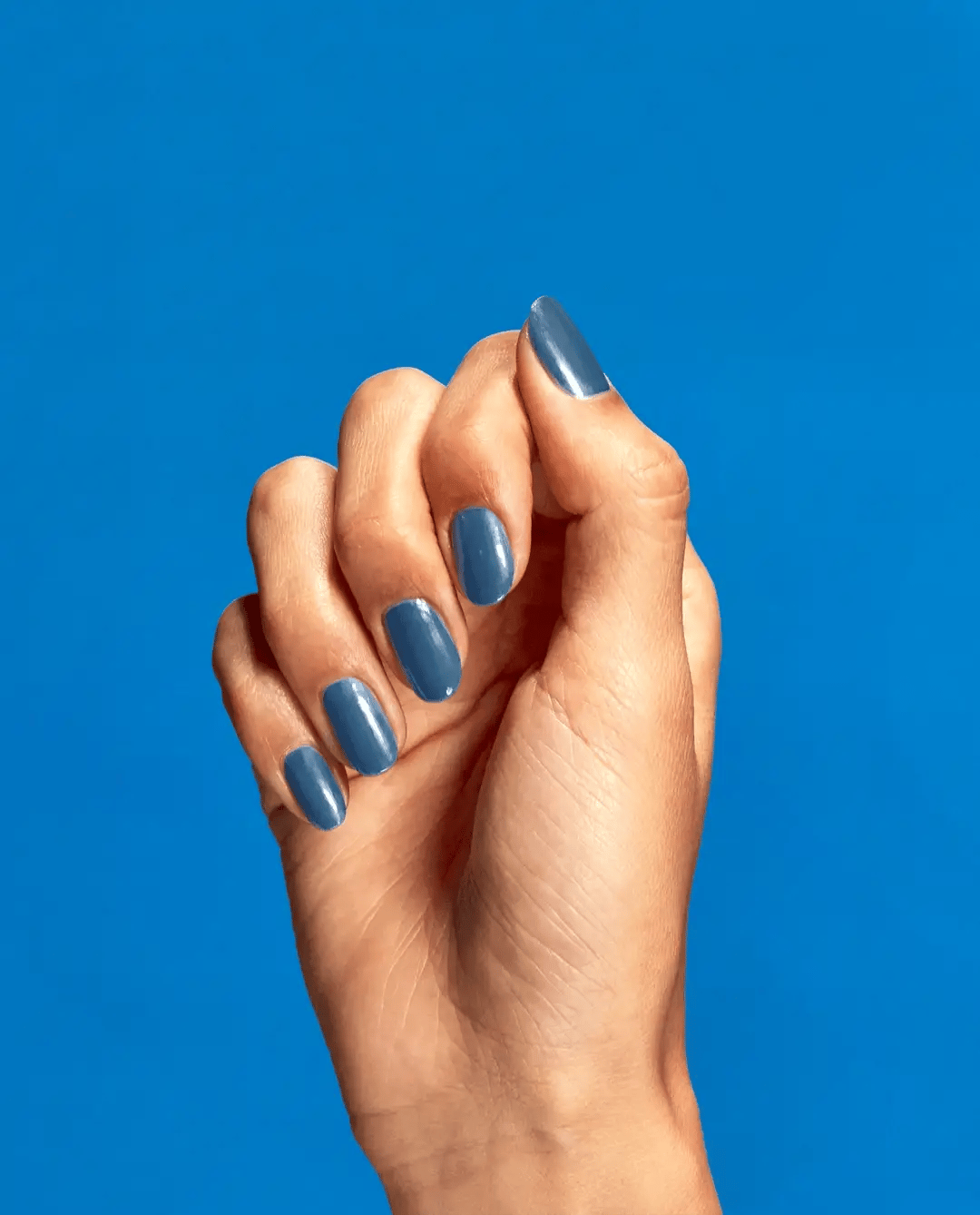 OPI nail polish in Suzi Takes A Sound Bath shade, showing a vibrant, glossy purple color in a close-up image.