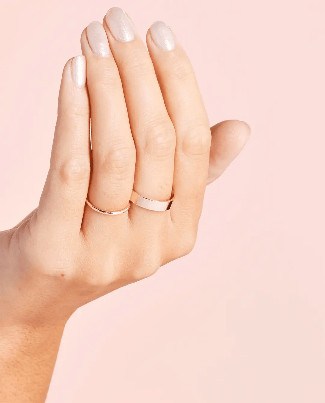 OPI Throw Me a Kiss nail polish bottle with pink and gold cap, showcasing the vibrant pink shade and sleek design.