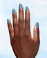 OPI Nature Strong Big Beautiful Planet nail polish on a hand with a vibrant blue manicure featuring natural-inspired design.