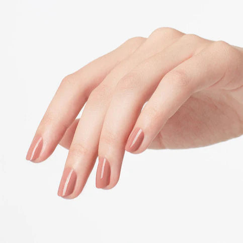 OPI Powder Perfection Barefoot in Barcelona powdered nail color with a natural nude finish, displayed on a hand with a manicured nail.