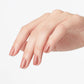 OPI Powder Perfection Barefoot in Barcelona powdered nail color with a natural nude finish, displayed on a hand with a manicured nail.