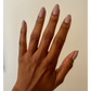 Orly Nail Lacquer in In The Conservatory, clear glass bottle with black cap, showcasing the nail polish color and branding.