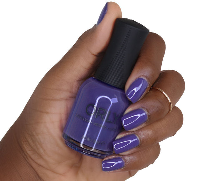 Orly Nail Lacquer in Indigo Skies with vibrant blue nail polish color and glossy finish, displayed in a clear bottle.