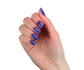Orly Nail Lacquer Indigo Skies bottle with vibrant blue nail polish, showcasing the sleek nail polish bottle and cap.