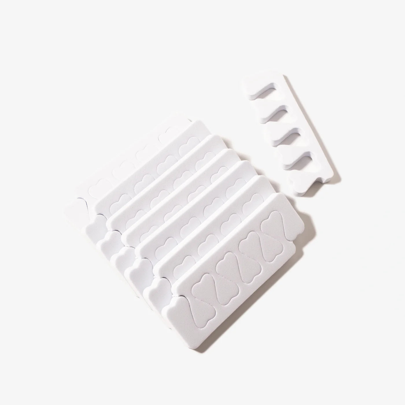White Sirooni Toe Separator 4-Hole pack with 100 pieces, designed for toe alignment and comfort, from Sirooni Professional.