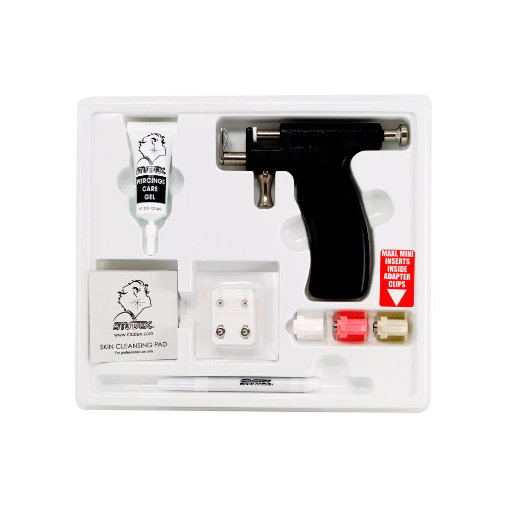 Studex UNS ear piercing starter kit with sterile tools and earrings for safe, professional ear piercing.