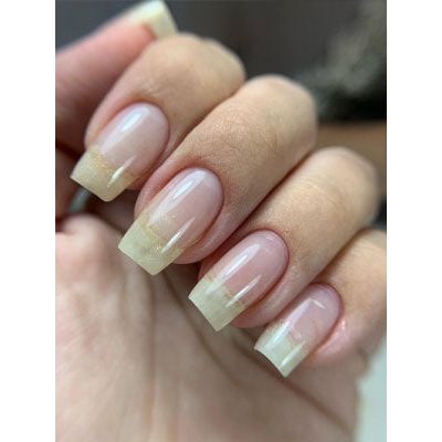 Tres Jolie gel nail polish with strong base coat, shown in a clear bottle with a brush applicator and vibrant nail color.