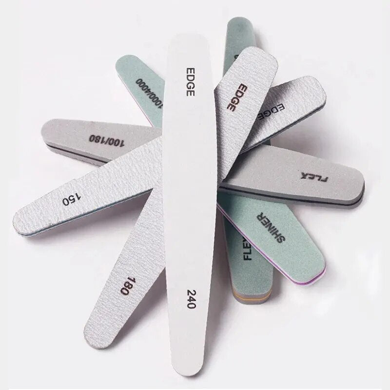 Set of six UNS professional nail files and buffers, featuring smooth and textured surfaces for nail shaping and polishing.