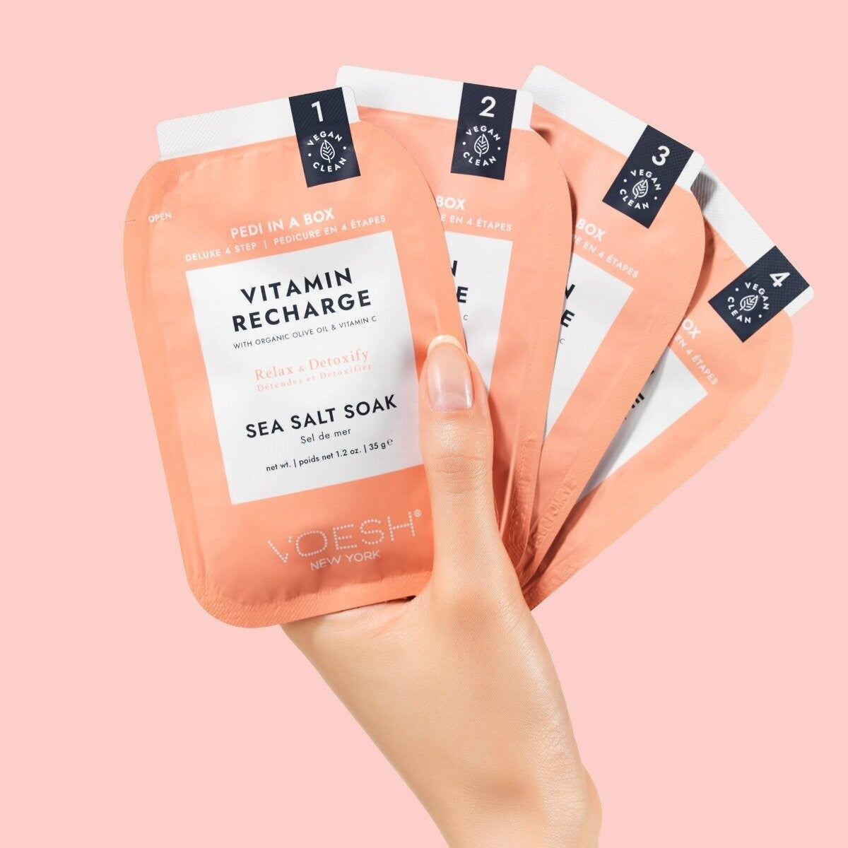 Voesh Pedi In A Box Vitamin Recharge 4 Step kit with colorful foot soak, scrub, mask, and moisturizer in a compact package.